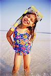 Young Girl Standing in Water Wearing Mask and Snorkel