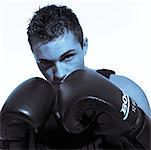 Young Man Wearing Boxing Gloves