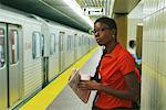 Woman Waiting for Subway Train