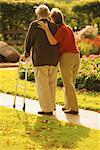 Mature Couple Walking in Garden