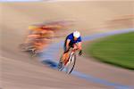 People Bicycle Racing on Track