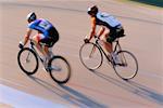 People Bicycle Racing on Track