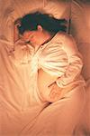 Pregnant Woman Lying in Bed