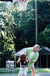 Father and Son Playing Basketball