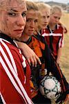 Portrait of Muddy Female Soccer Players