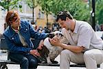 Couple and Dog on Bench