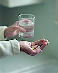 Elderly Women Holding Pills