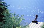 Woman Doing Yoga on Dock