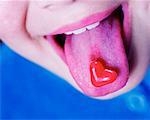 Child with Candy Heart On Tongue