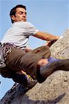 Man Climbing Rock Face