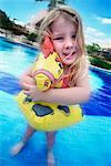 Girl Playing in Swimming Pool