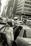 Woman Getting out of a Taxi New York City, USA