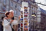 Couple Looking at Postcards