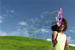 Girl Playing with Bubble Wand