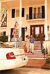 Couple Walking Down Stairs at Inn