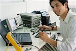 Computer Technician Testing Circuit Boards