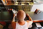 Man Sitting at Diner Counter