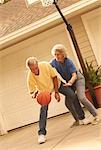 Mature Couple Playing Basketball