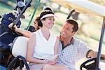 Couple en voiturette de Golf