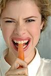 Woman Eating Carrot