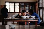 Men Eating Rice Lunan, Yunnan Province China