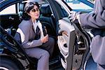 Businesswoman Getting Out of Car