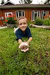 Boy with Frog in Frontyard