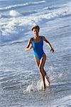 Woman Running on Beach