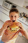 Boy Eating Hamburger