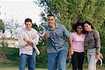 Group of Friends Playing Horseshoes