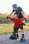 Mother Teaching Son to In-Line Skate