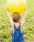 Child Holding Ball
