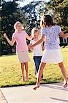 Three Girls Playing Hopscotch