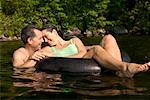 Couple Swimming Long Pond, Belgrade Lakes Maine, USA