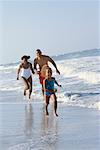Family Running on Beach