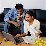 Couple Using Laptop to Check Their Personal Finances