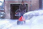 Senior Using Snow Blower