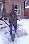 Senior Shovelling Snow