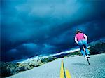 Woman on Road with Pogo Stick