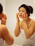 Woman Applying Moisturizer