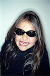 Girl Wearing Sunglasses and Smiling