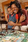 Mother and Daughter with Puzzle