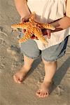 Child Holding Starfish