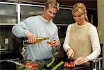 Couple with Glasses of Wine in Kitchen