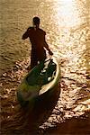 Man Pulling a Sea Kayak
