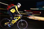 Man Biking at Night