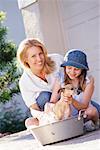 Mother and Daughter Washing Dog