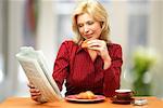 Woman Eating Croissant