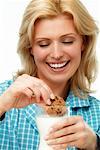 Woman Eating Cookies and Milk