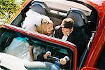 Bride and Groom in Convertible